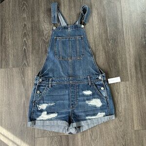 Brand new American Eagle size medium blue denim overalls with distressed details